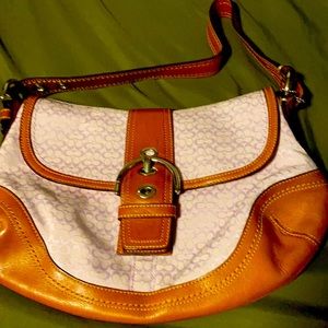 Brand new Coach Cognac and lilac colored purse.